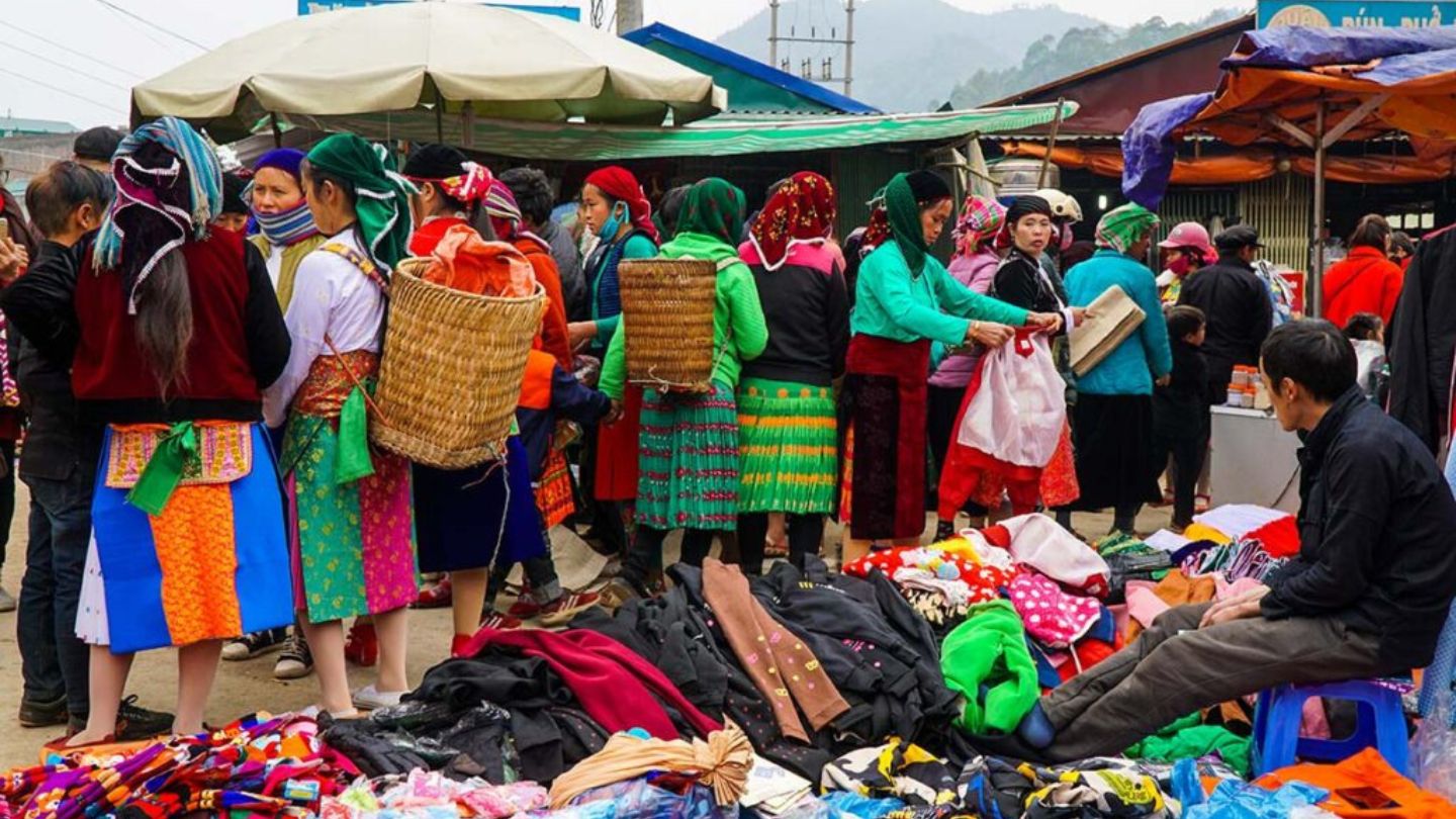 Visitors exploring handmade goods at Dong Van Market